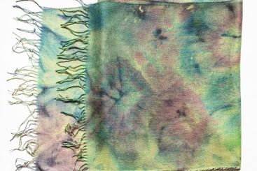 folded cashmere scarf coloured in Tie-dye batik