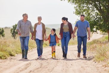 Holding hands, family and walking with child on farm for...