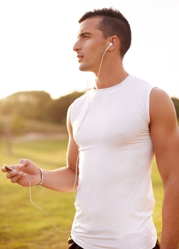 Sports, earphones and man in nature for running exercise...