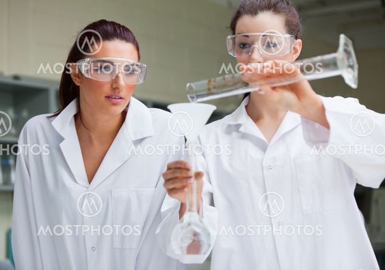 Gorgeous science students doing an experiment