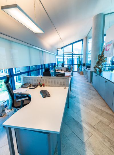 Modern office interior with chairs and desktops