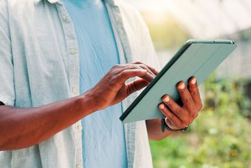 Greenhouse, farming and hands with tablet for research,...