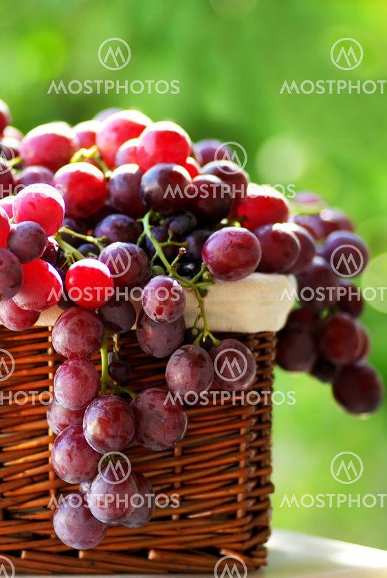 red grapes in a basket.
