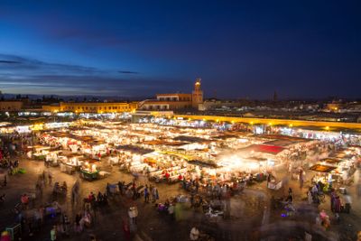 Jamaa el Fna market square at dusk, Marrakesh, Morocco,...