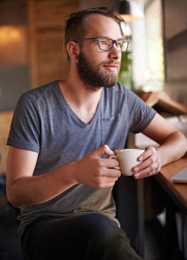 Coffee, thinking and man in cafe with remote work for...
