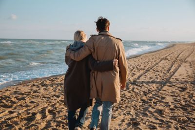 couple hugging on seashore
