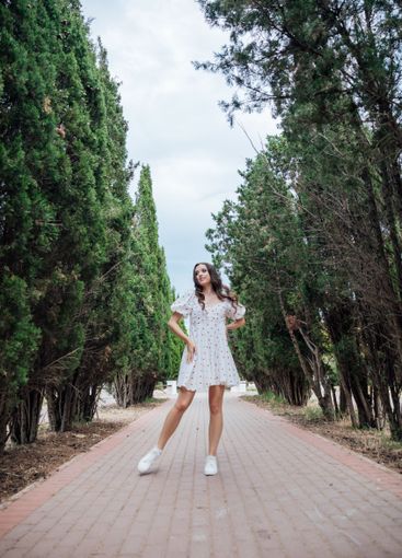 Beautiful slim fashionable brunette woman in summer...