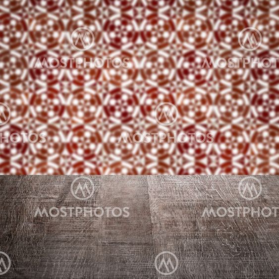 Wood table top and blur vintage ceramic tile pattern wall
