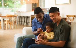 Diverse Same Sex Male Couple Family Enjoying Quality Time...