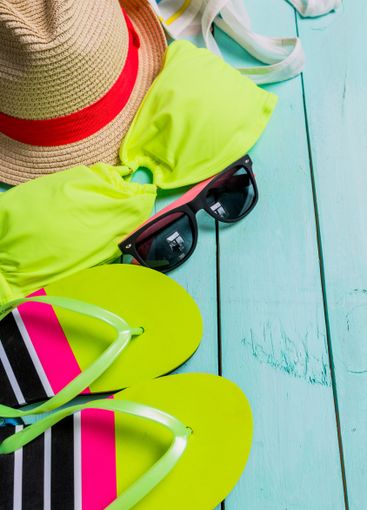 Beach accessories with yellow swimming suit,sunglasses...