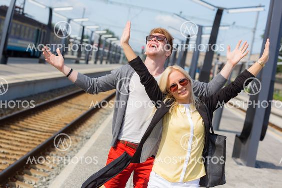 Young Couple Waiting at Train Station