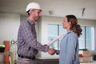 Home Renovation Contractor And Happy Woman