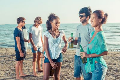 Group of Friends Having a Party on the Beach