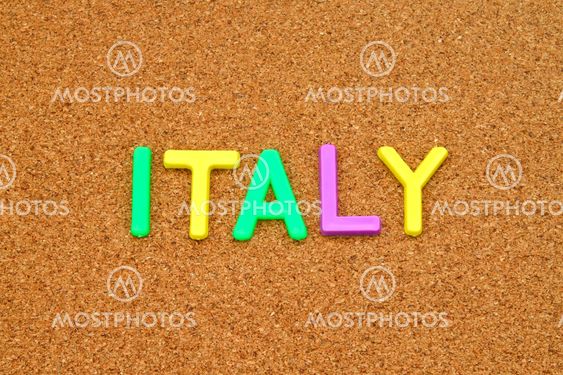 Italy in colorful toy letters on cork background