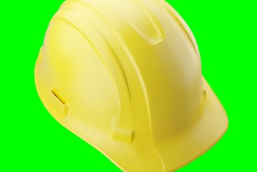 Yellow Construction Hard Hat Isolated on a Green Screen.
