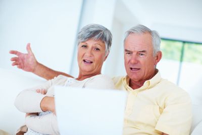Shocking bills. Shocked mature couple reading domestic...