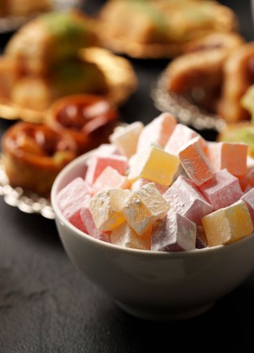 Traditional sweets displayed in a bowl with assorted...