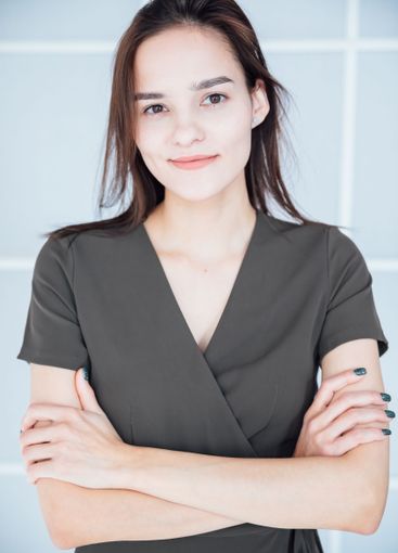 beautiful fashionable slender woman in a gray summer...