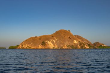 A Serene Island Landscape at Dusk, Over Calm Waters...
