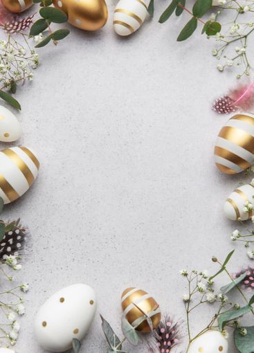Easter eggs frame decorating a gray surface with...