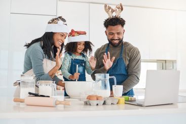 Baking, video call and parents with child on laptop for...