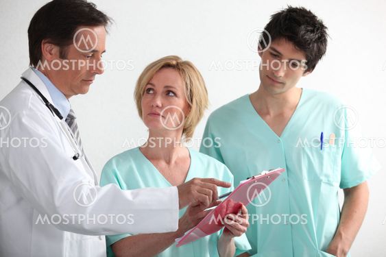 Hospital team reading a chart