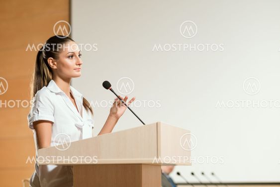 Portrait of a business woman with microphone