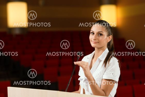 Portrait of a business woman with microphone