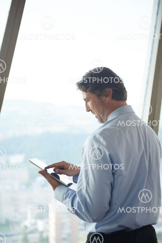 handosme business man working on tablet