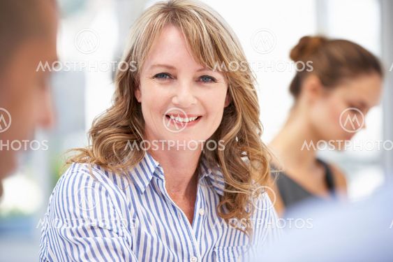 Mid age businesswoman in meeting