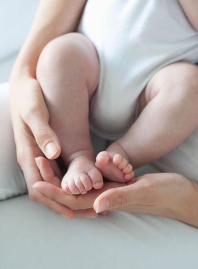 Mother Holding Baby Boy's Feet