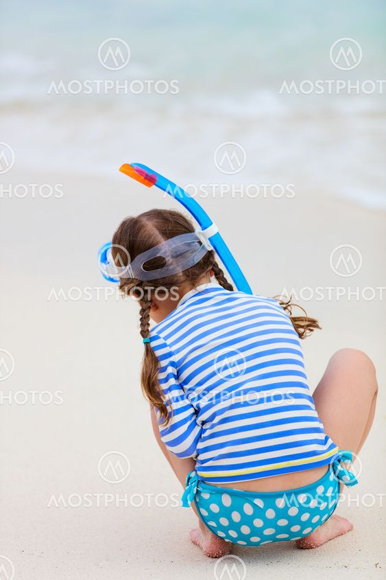 Adorable little girl at beach