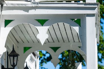 Wooden details of a traditional white house.