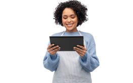 smiling woman in apron with tablet pc computer