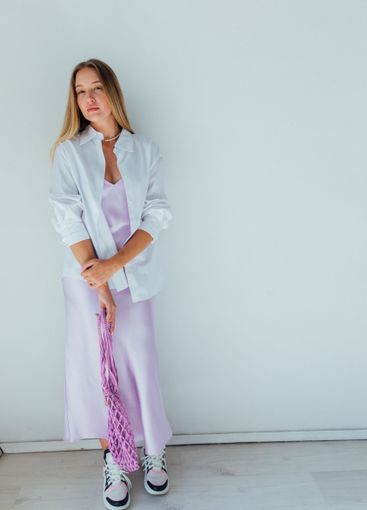 Beautiful woman in summer dress on a white background