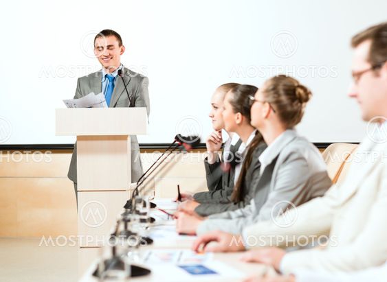businessmen communicate at the conference