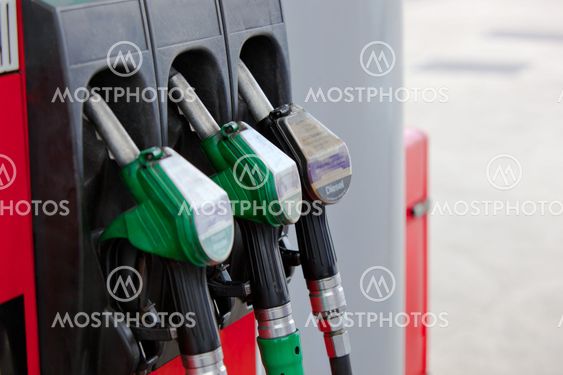 Close-up of a gasoline pumps nozzles in a petrol station