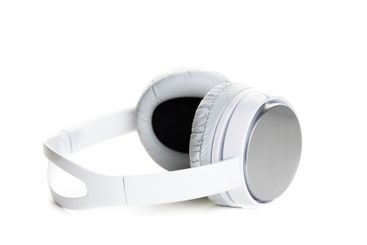 White headphones on white background close up