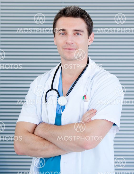 Charismatic male doctor looking at the camera
