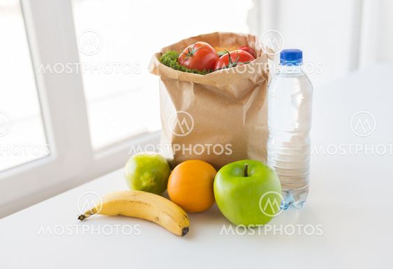 basket of vegetable food and water at kitchen