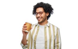 smiling young man with takeaway coffee cup