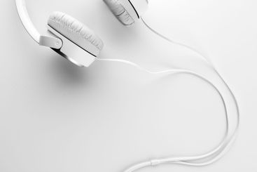 White headphones on white background close up