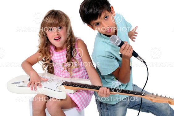 Kids pretending to be in a rock band