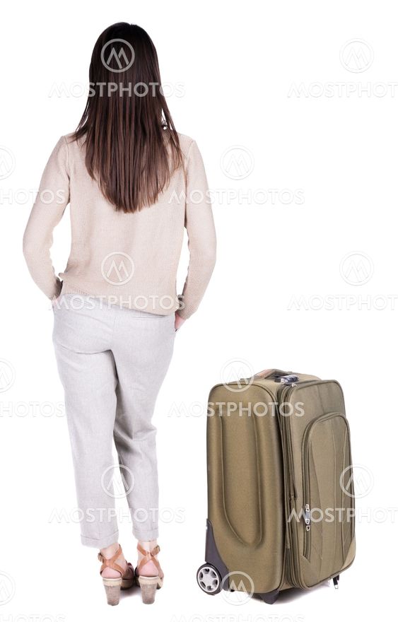 back view of standing young beautiful brunette woman.