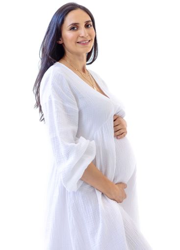 Portrait of an attractive young pregnant woman in a...