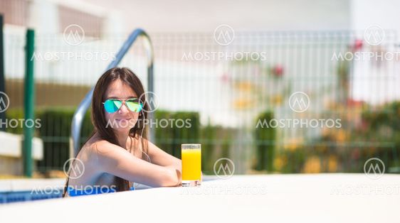 Young beautiful woman listening music with headphones...