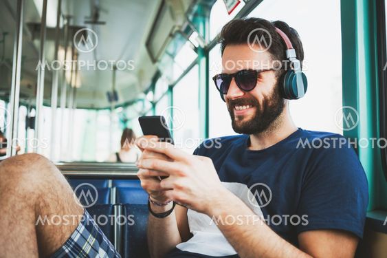 Young man riding in public transport