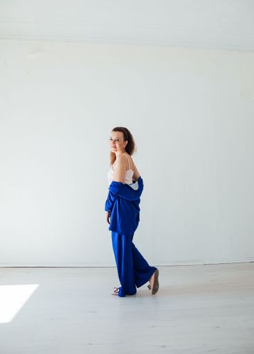 Brunette woman 40 years old in blue summer suit