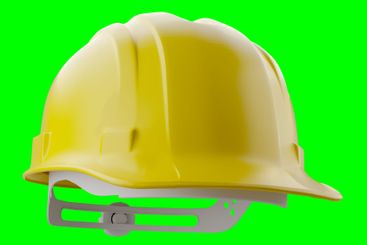 Yellow Construction Hard Hat Isolated on a Green Screen.