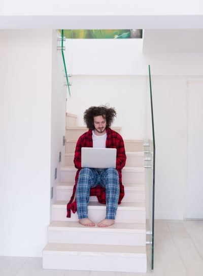 freelancer in bathrobe working from home